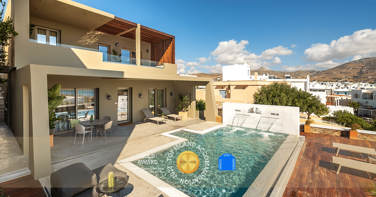 A luxury villa in Tinos with external private swimming pool in an open country side, near town, looking to the sea, with an gold award logo "Top Island Accommodation 2023 - Greece Stay Awards"